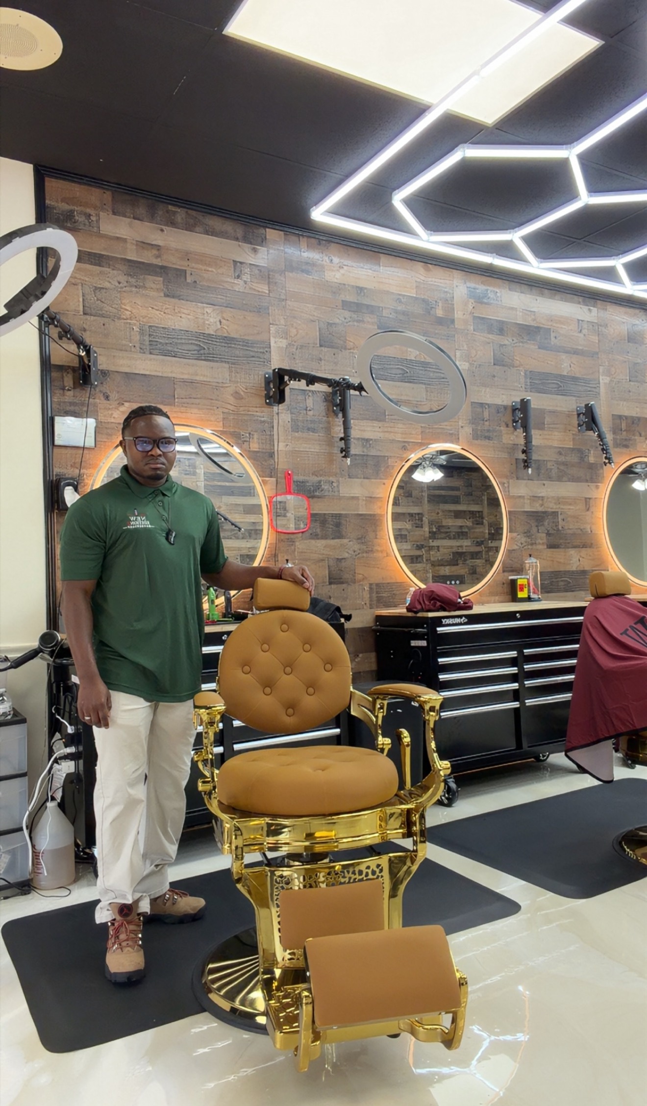 Bakary Kassama inside the barbershop